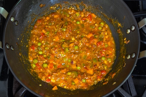 adding water to make masala pasta sauce