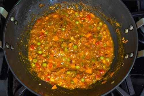 adding water to make masala pasta sauce