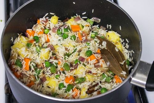 mixing rice and veggies
