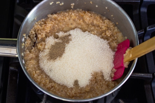 adding sugar and cardamom powder