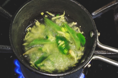 tempering of ginger, green chilies and curry leaves