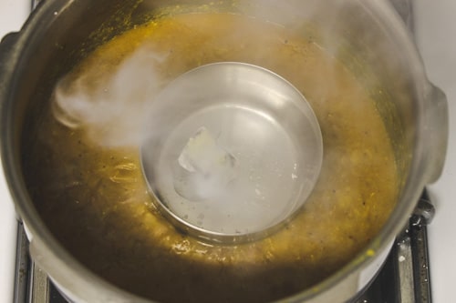 adding ghee on hot charcoal