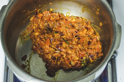 cooking spices with onion tomto masala