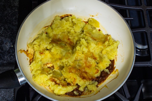 adding boiled, mashed potato