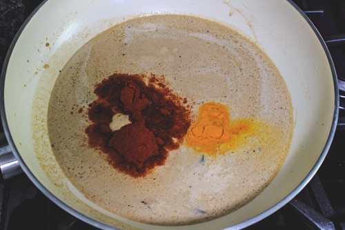 adding red chili powder, turmeric powder