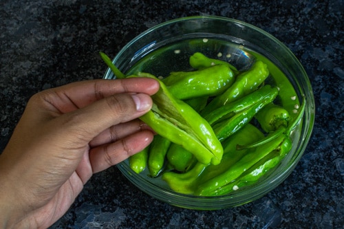 chili peppers in salted water