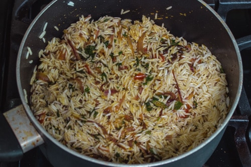 adding soaked basmati rice