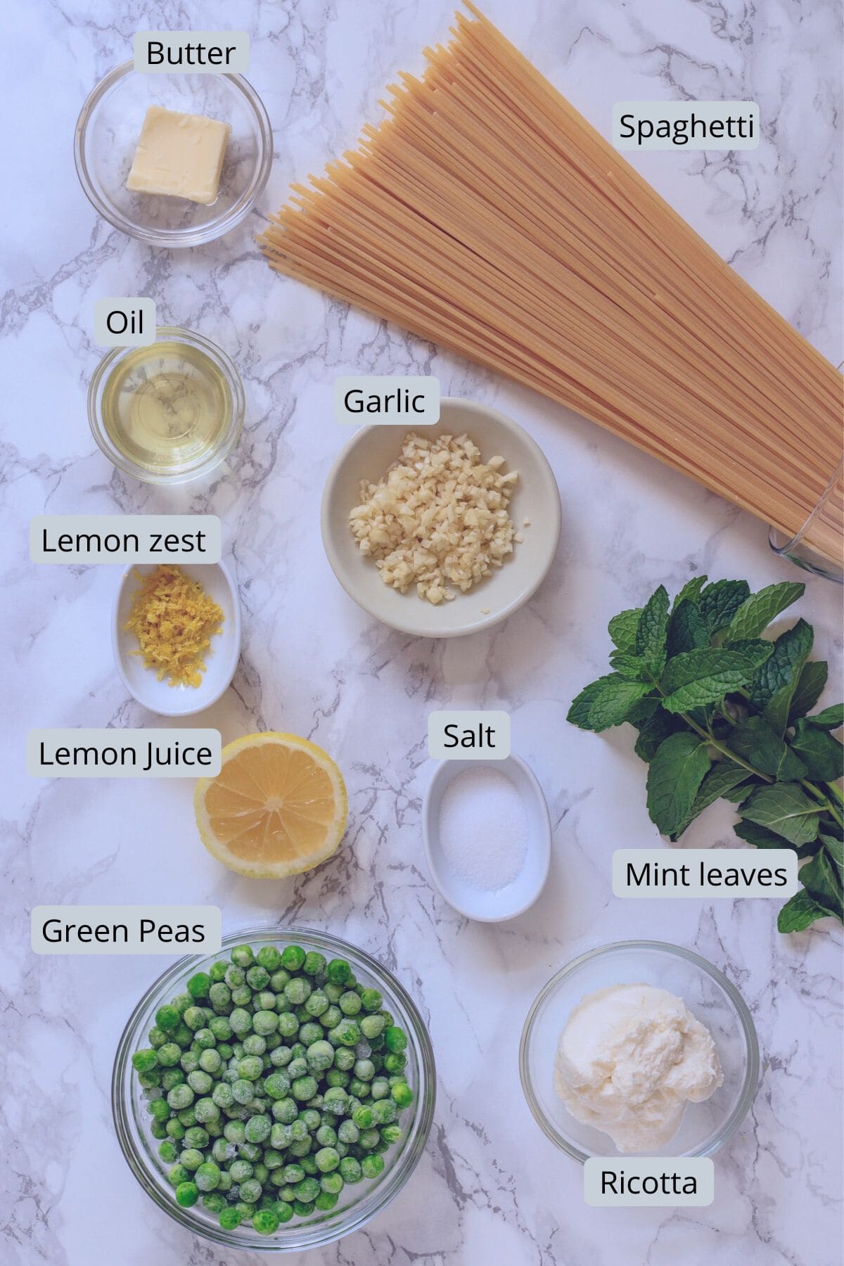 ingredients in individual bowls for peas, ricotta pasta