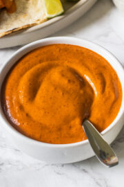 Close up image of chipotle sauce in a bowl with spoon