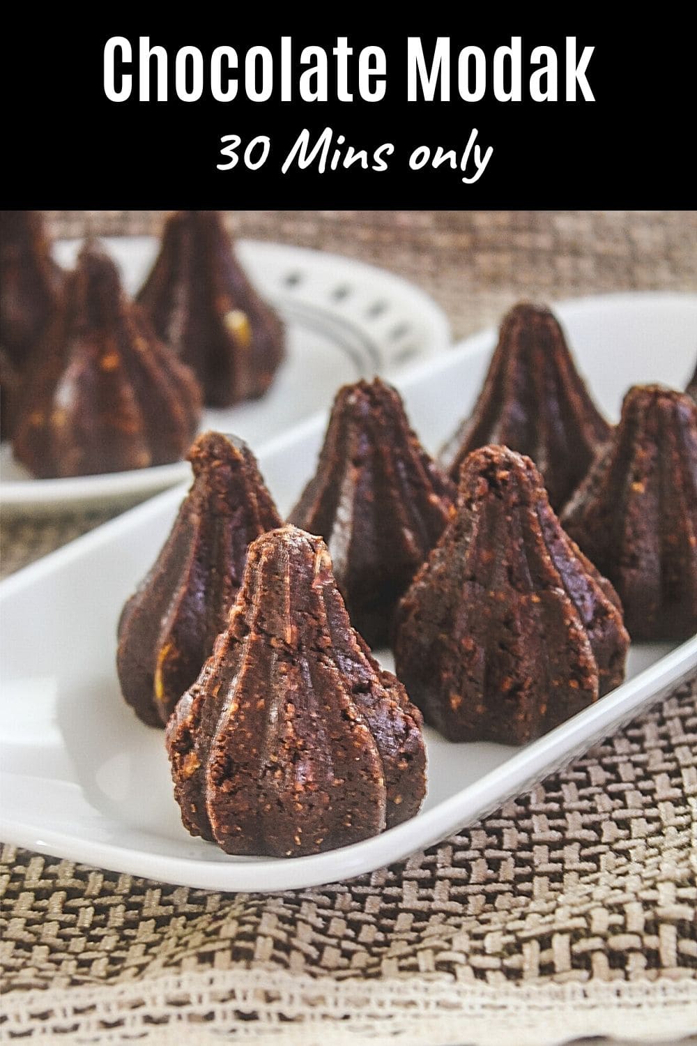 image of chocolate modak arranged on a plate with text on top for pinterest