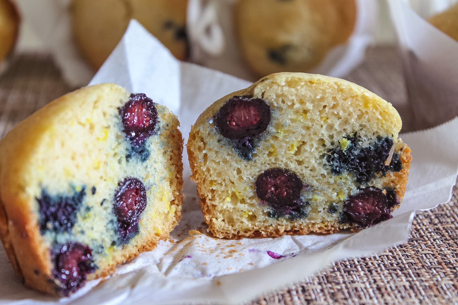 Close up pic of showing inside of blueberry muffins by cutting into half