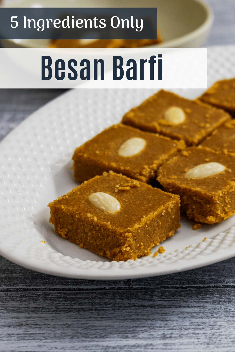 besan barfi pieces in a plate with text on top.