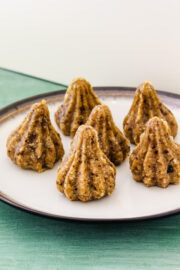 6 dry fruits modak arranged on a plate