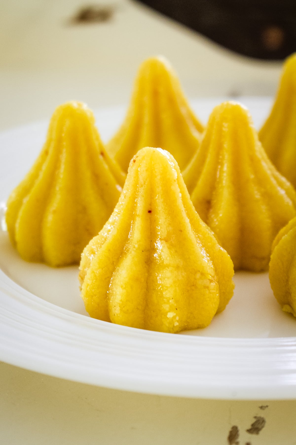 Close up of modak peda on a plate