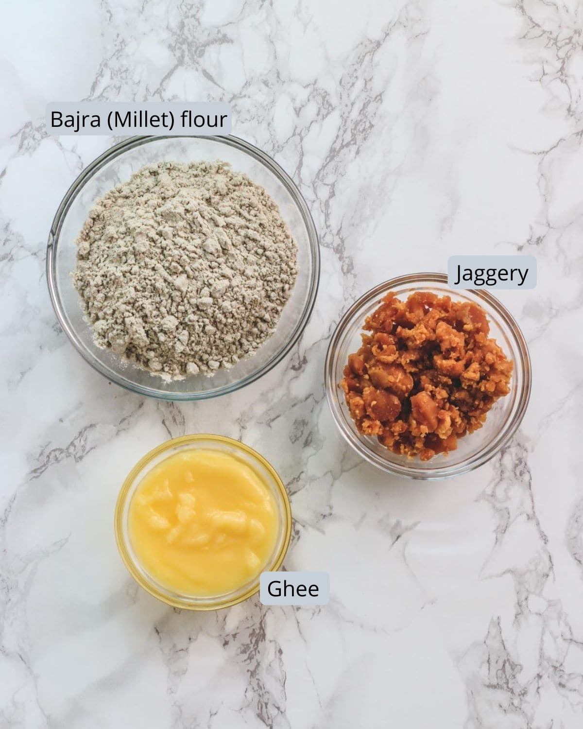 image of ingredients used in kuler. Shows bajra flour, jaggery, ghee