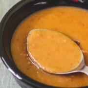 Moong dal kheer taken from a bowl using a spoon ready to eat