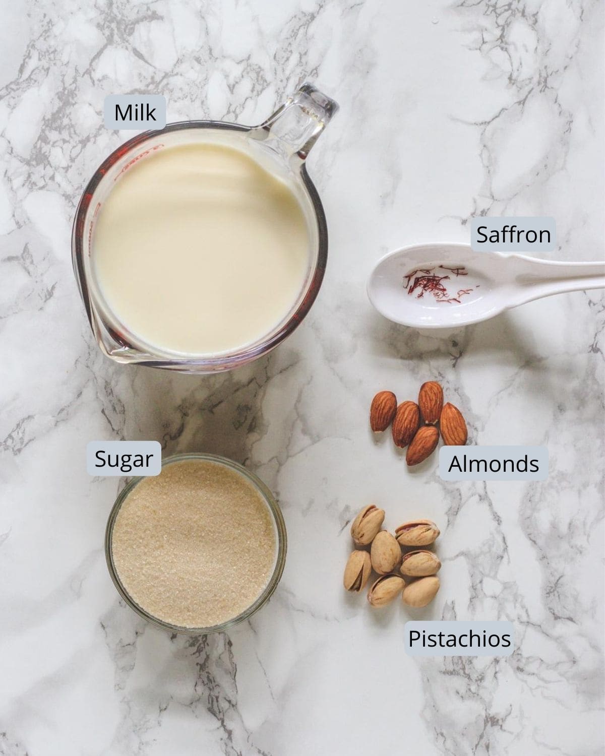 Ingredients used in rabri recipe includes milk, sugar, almonds, pistachios, saffron