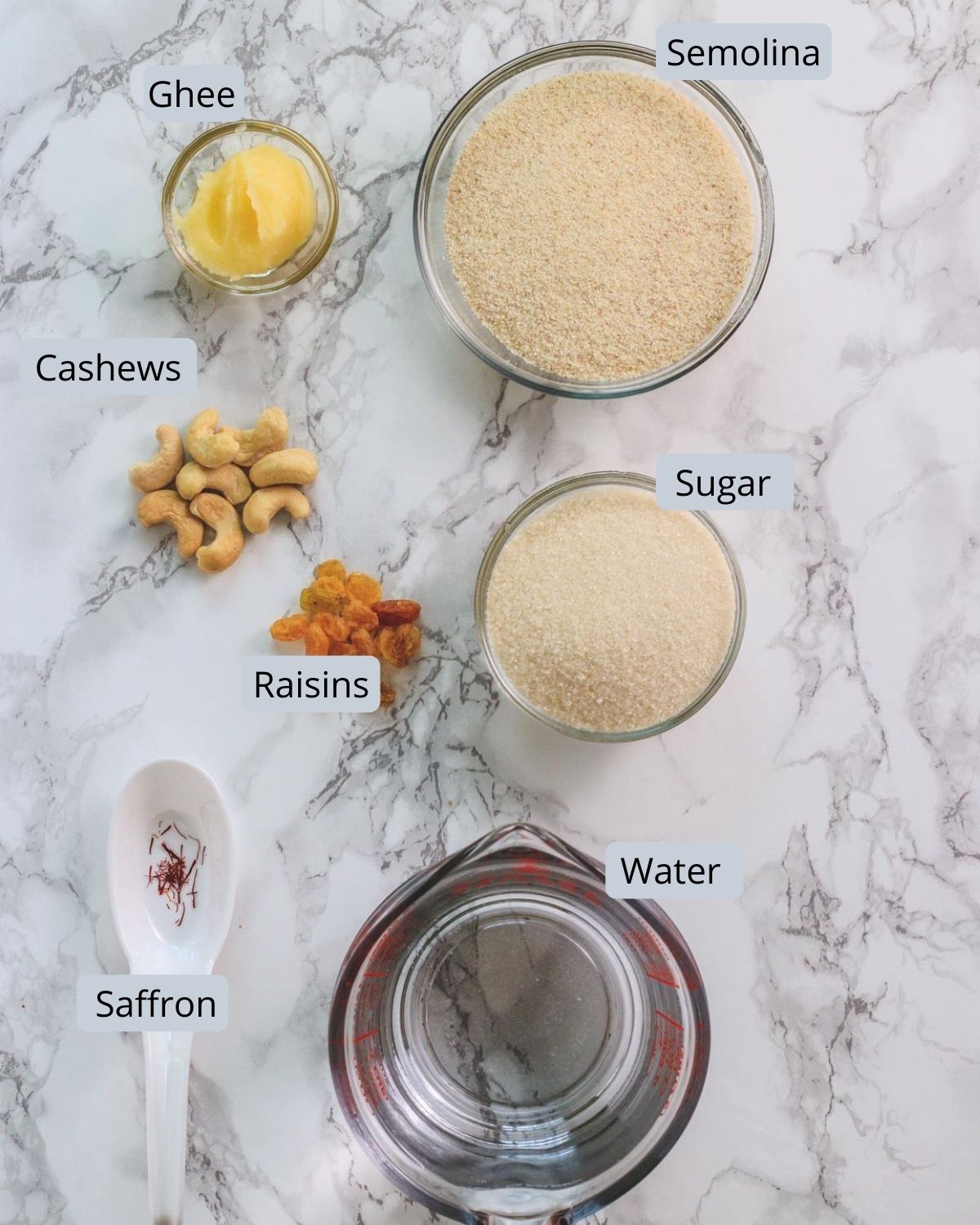 Image of ingredients used in rava kesari includes semolima, ghee, sugar, saffron, water, cashews, raisins