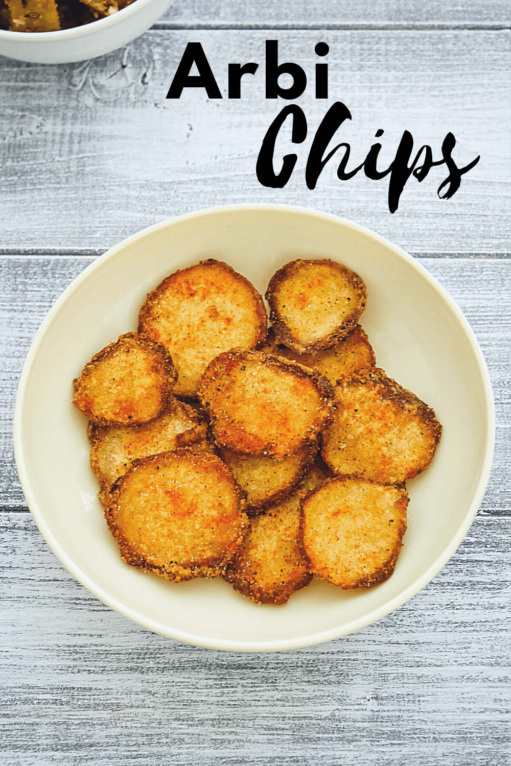 arbi chips in a plate with text on the image for pinterest