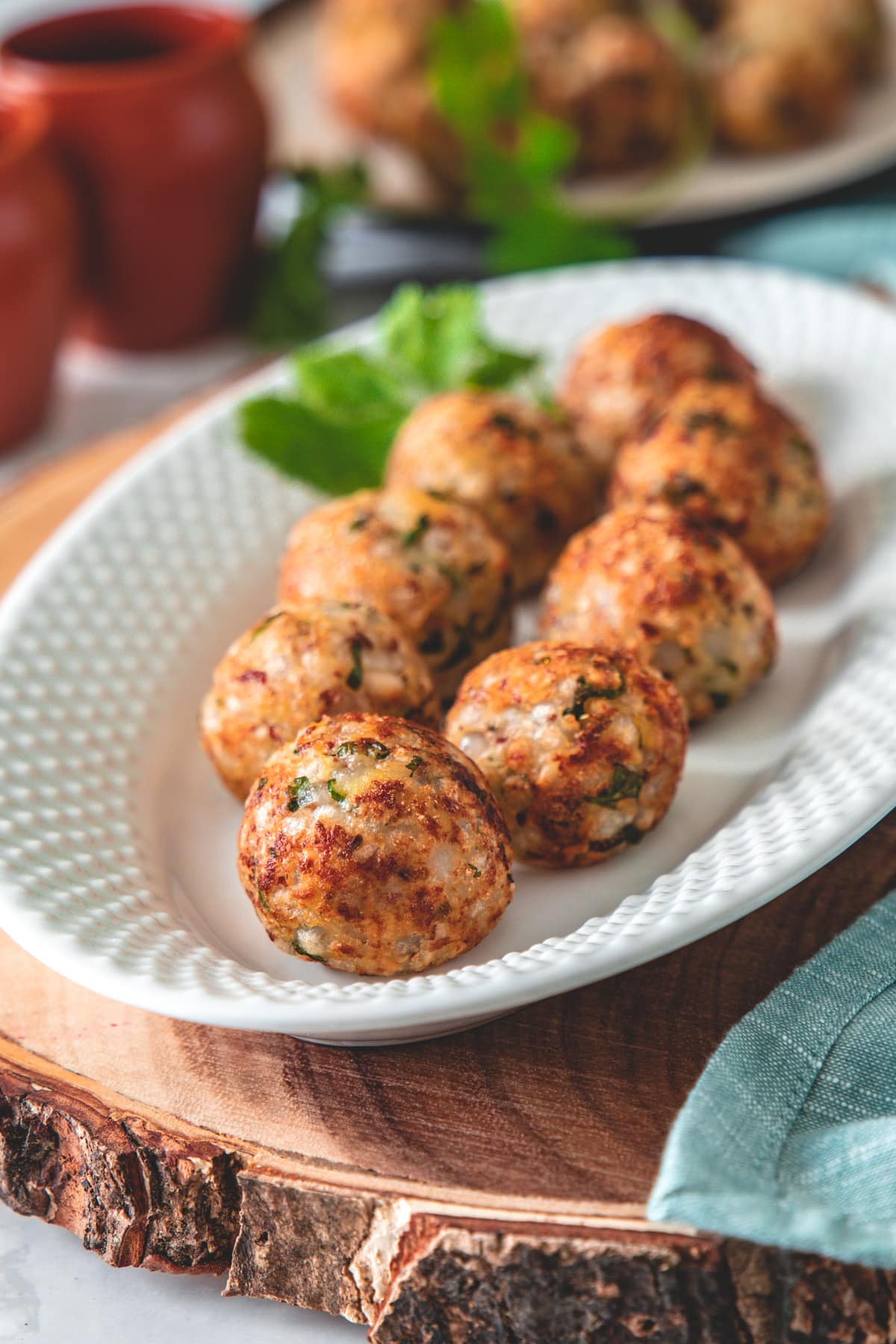 Close up of non-fried sabudana vada on a wooden board.