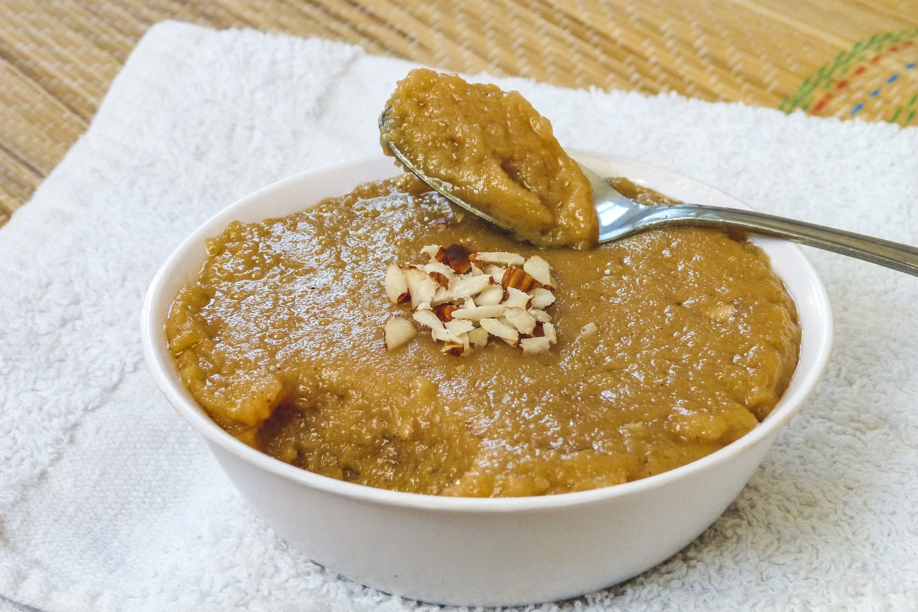 a spoon full ora rajgira halwa taken from the bowl and ready to eat