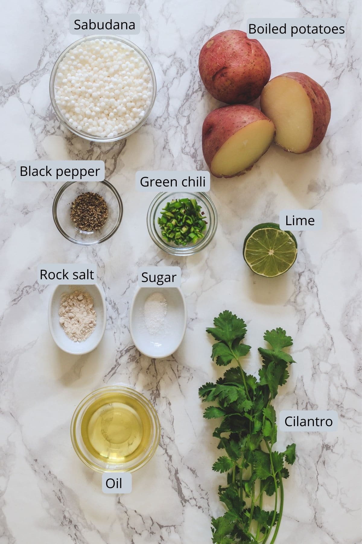 ingredients used in sabudana tikki includes tapioca, potatoes, salt, pepper, sugar, lime, cilantro, green chili and oill