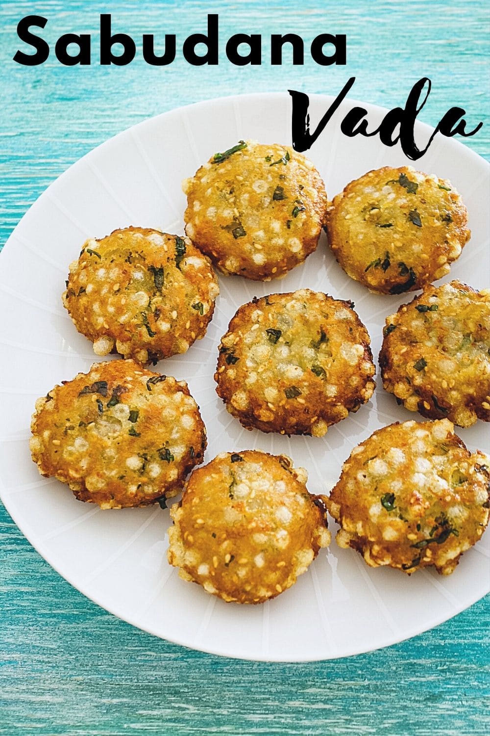 sabudana vada in a plate with text on top for pinterest