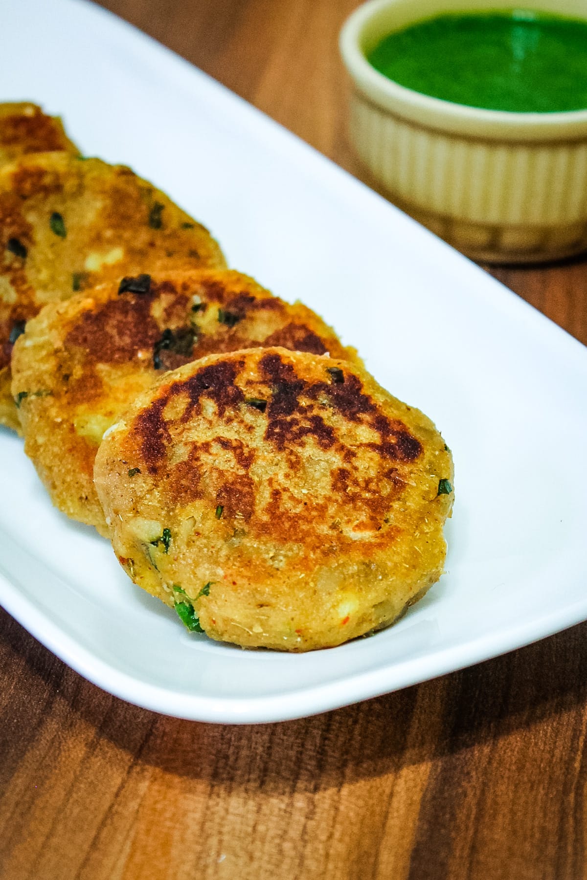 Close up of sweet potato tikki in a rectangle plate.