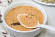 vrat ki kadhi in a bowl, a spoonful of taken from the bowl ready to eat