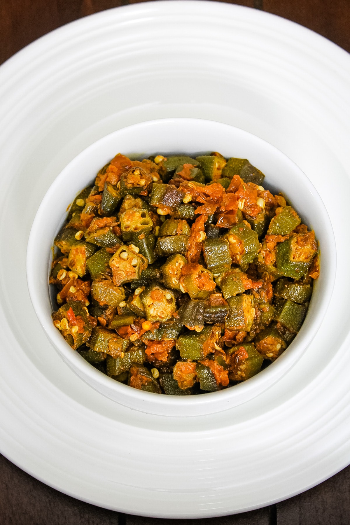 Bhendi chi bhaji served in a white bowl.