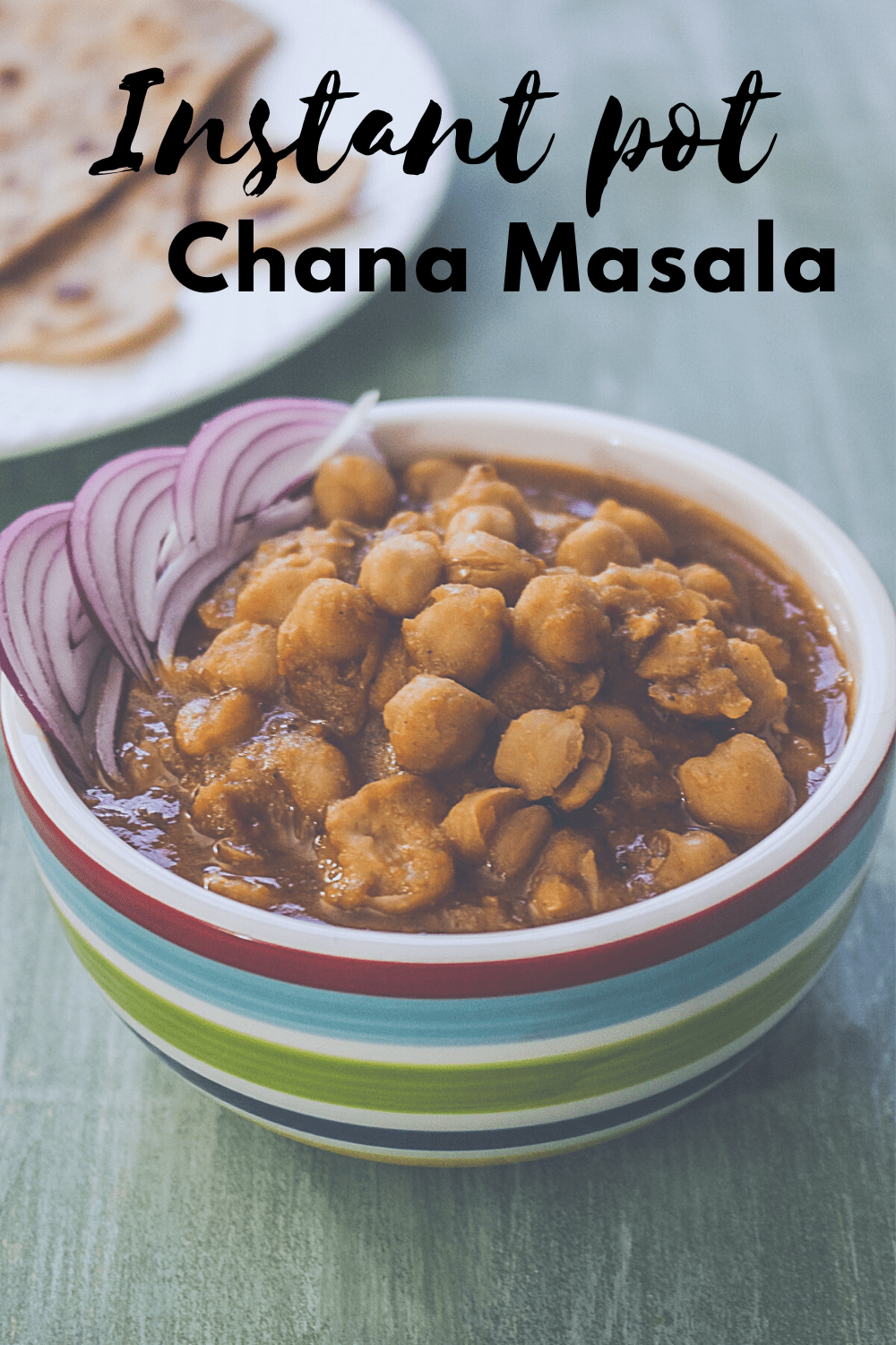 Chana masala in a bowl with garnish of onions with text on the image for pinterest