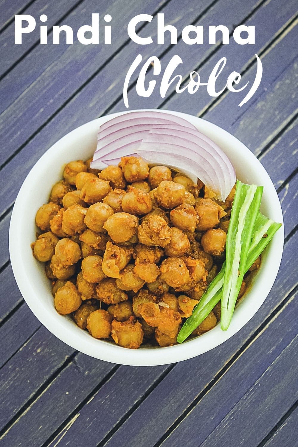 Pindi chana served with sliced onion, green chili with text on image for pinterest.