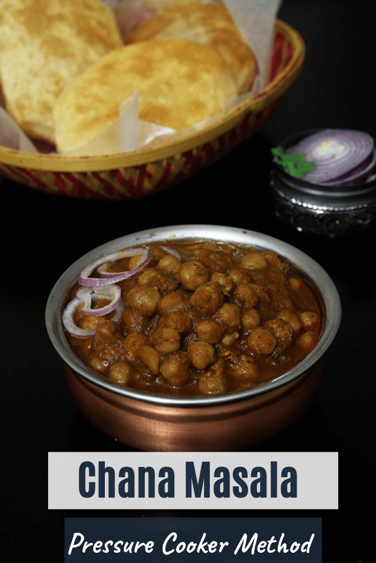Chole served with onion rings and bhatura.