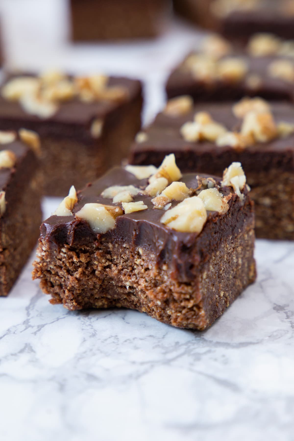 Close up of no bake brownie with one bite taken.