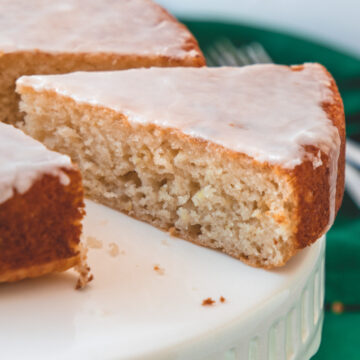Close up of a slice of eggless lemon cake showing the inside texture.
