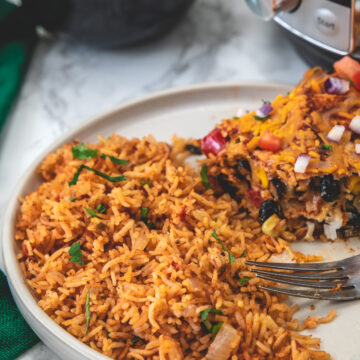 Instant pot mexican rice served in a plate with enchilada casserole.