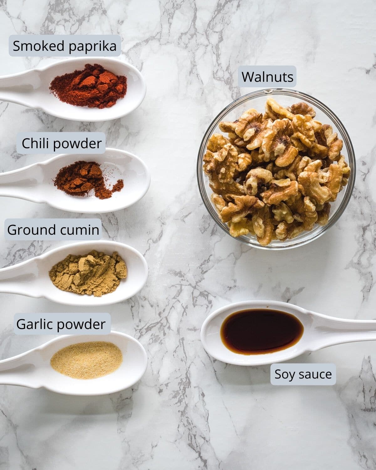 Ingredients used in making walnut meat are removed in individual bowl and spoons.