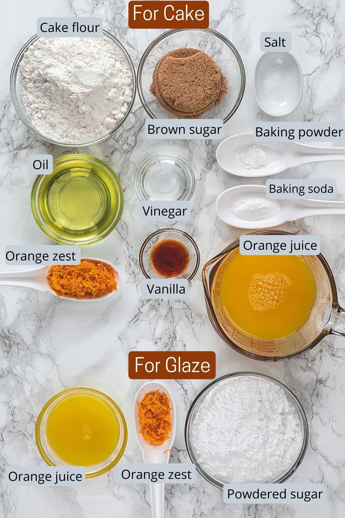 Ingredients for eggless orange cake in individual bowls and spoons.