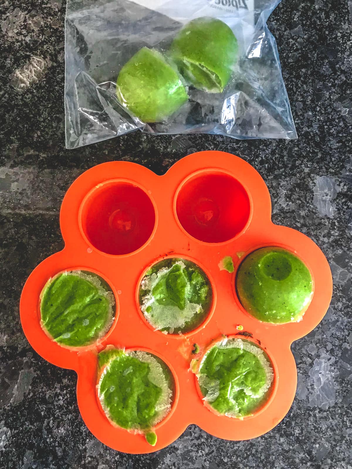 Frozen cilantro chutney in silicone mold and few in the zip lock bag.