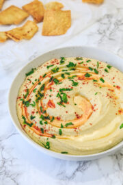 Instant pot hummus served with a drizzle of olive oil and sprinkle of paprika.