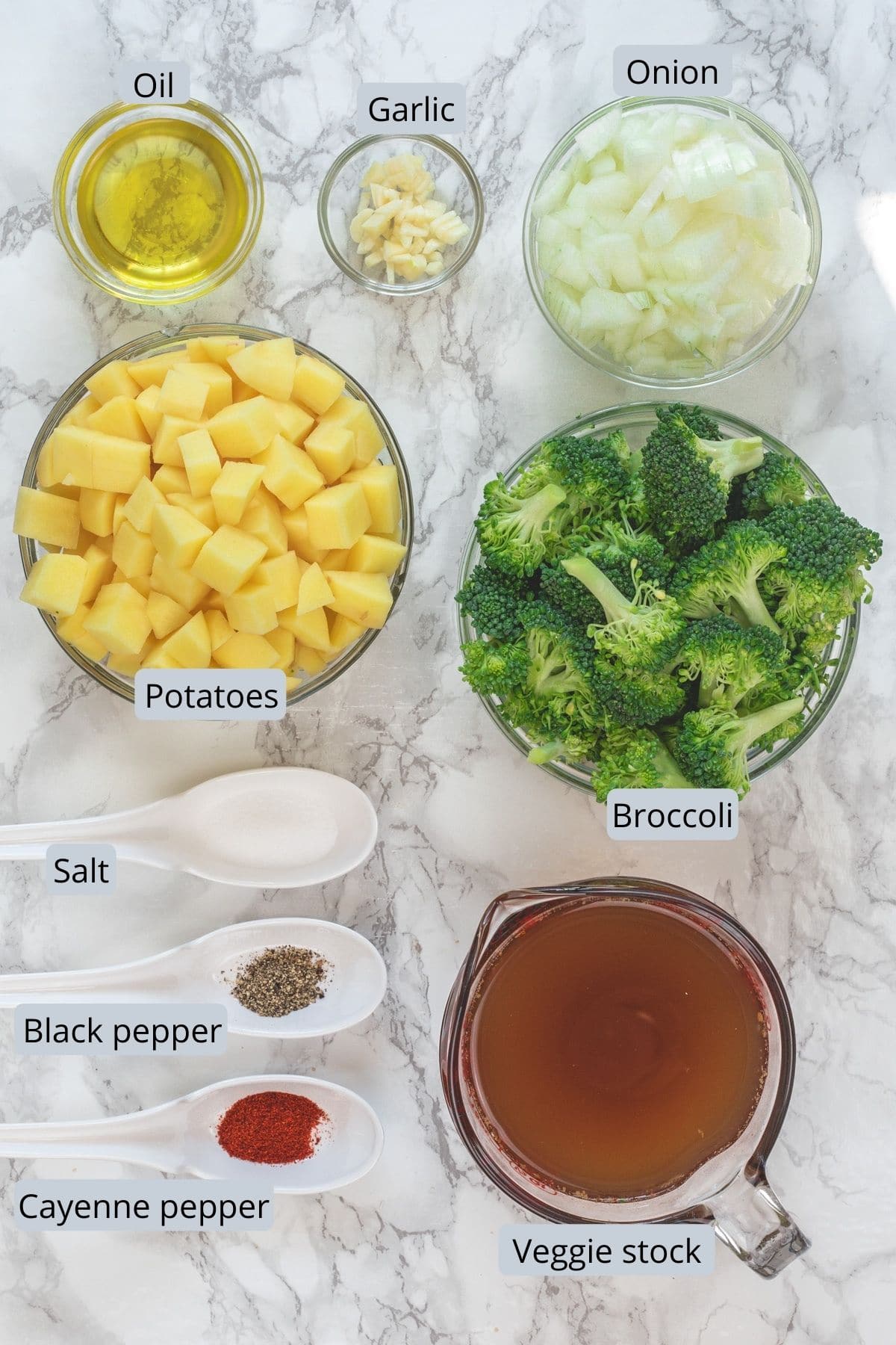 Instant pot broccoli potato soup ingredients in individual bowls and spoons.