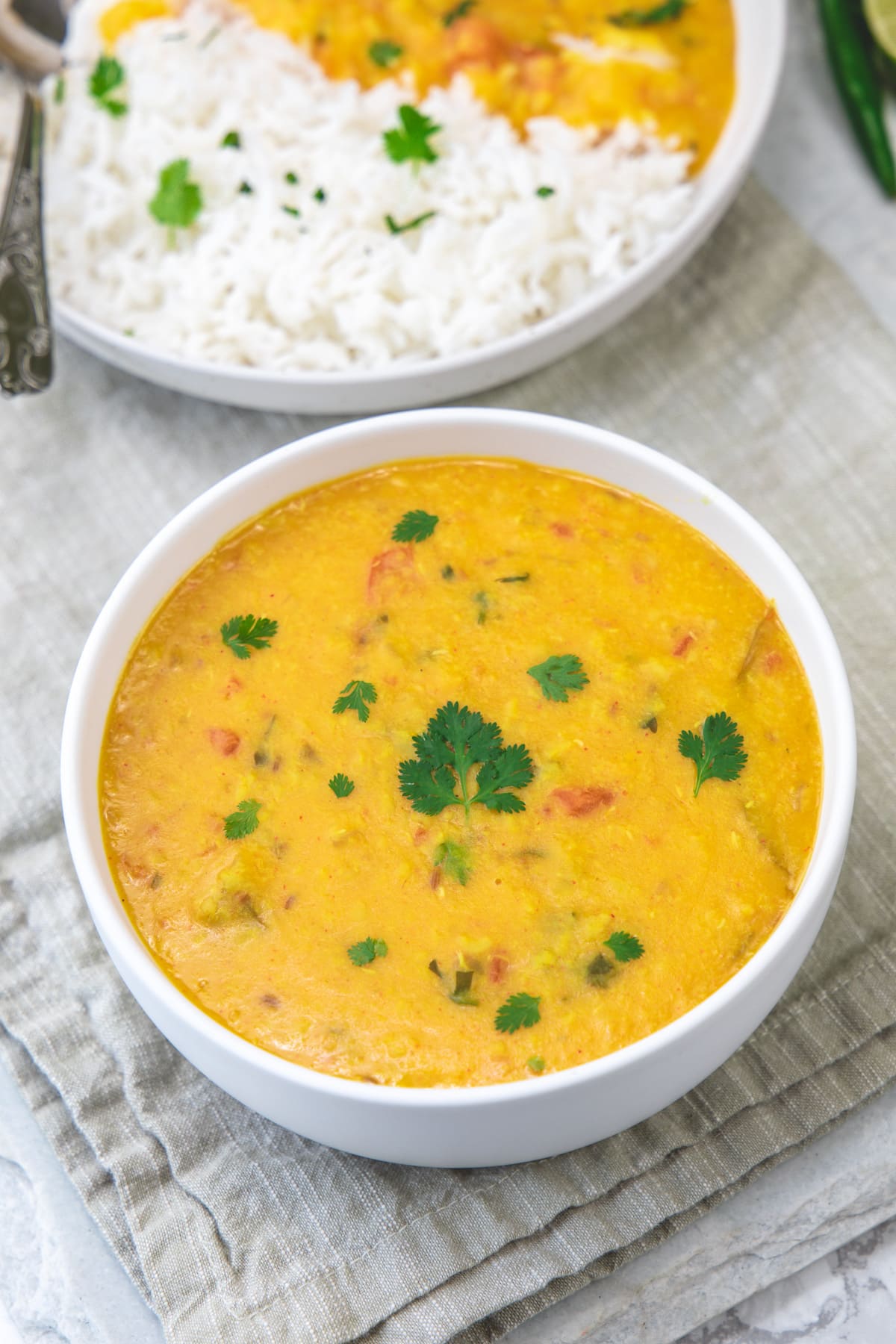 moong dal fry garnished with cilantro and served with rice.