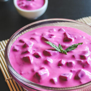 beetroot raita garnish with mint leaves.