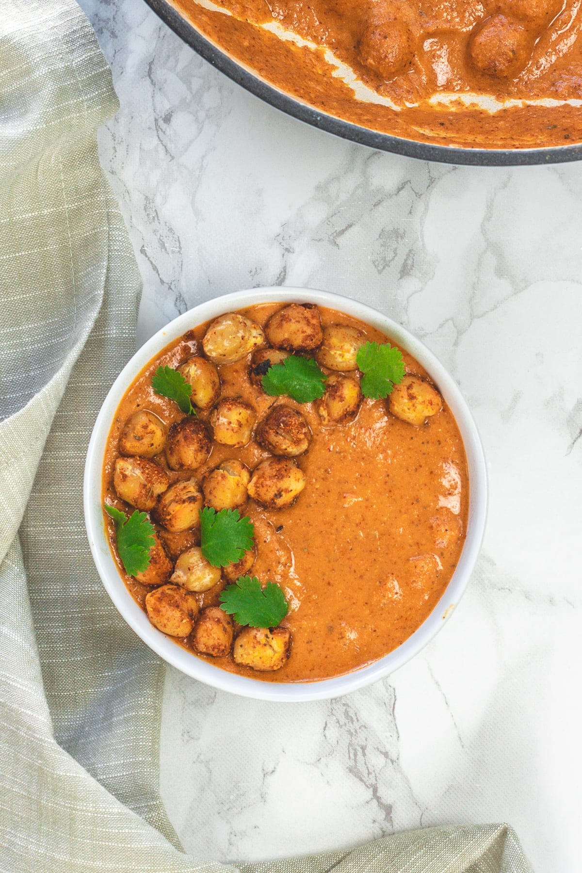 Chickpea tikka masala seved in a bowl garnished with cilantro.