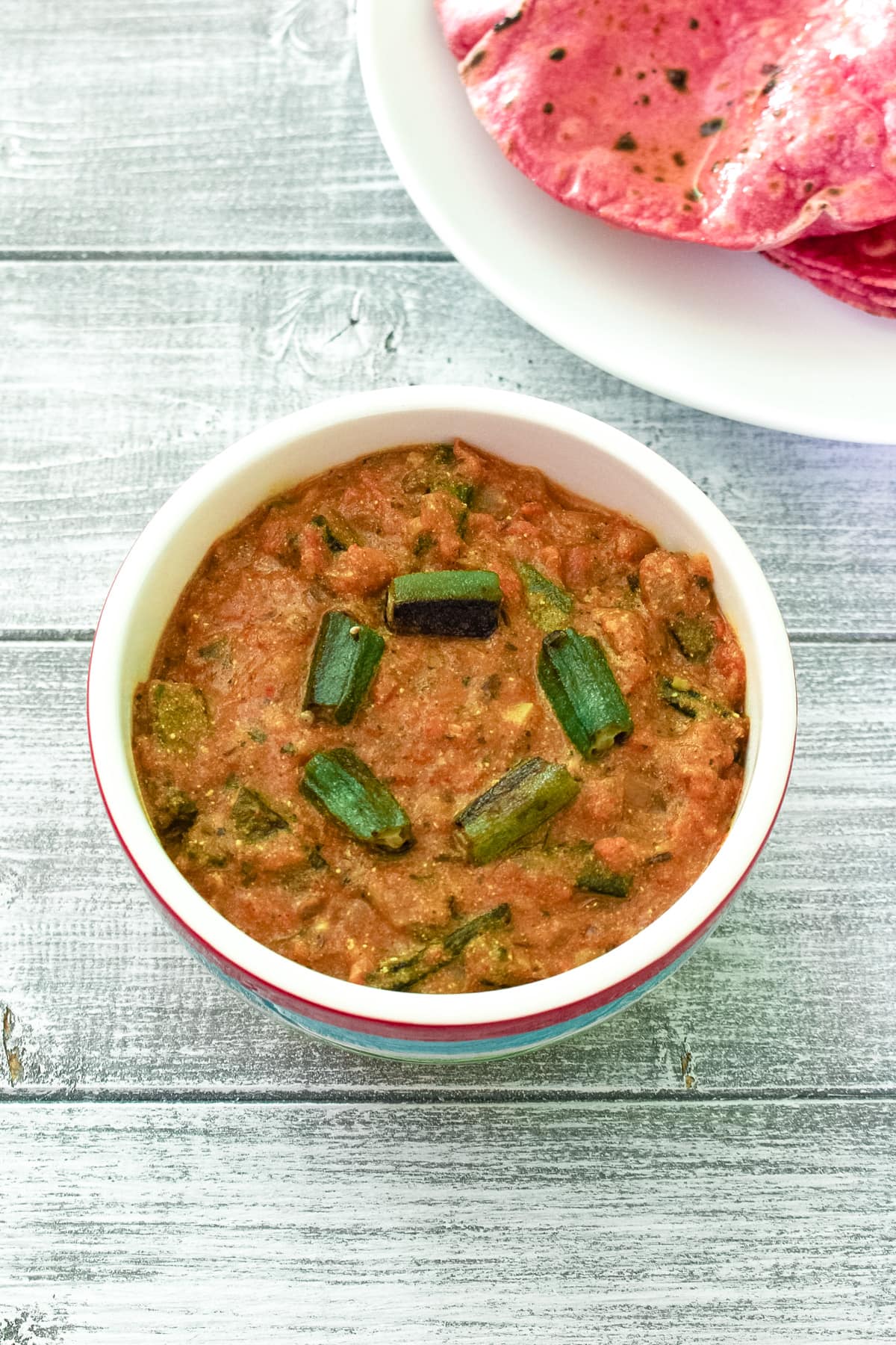 Dahi bhindi served with beetroot roti.