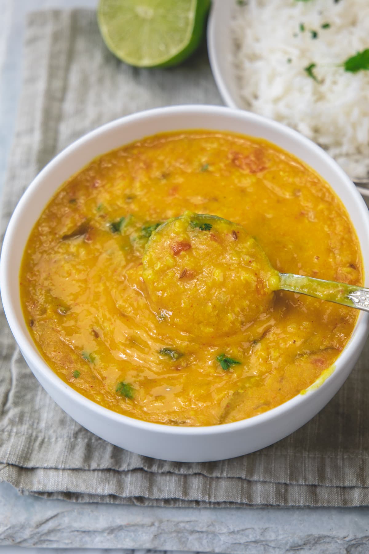 A spoonful of moong dal taking away.