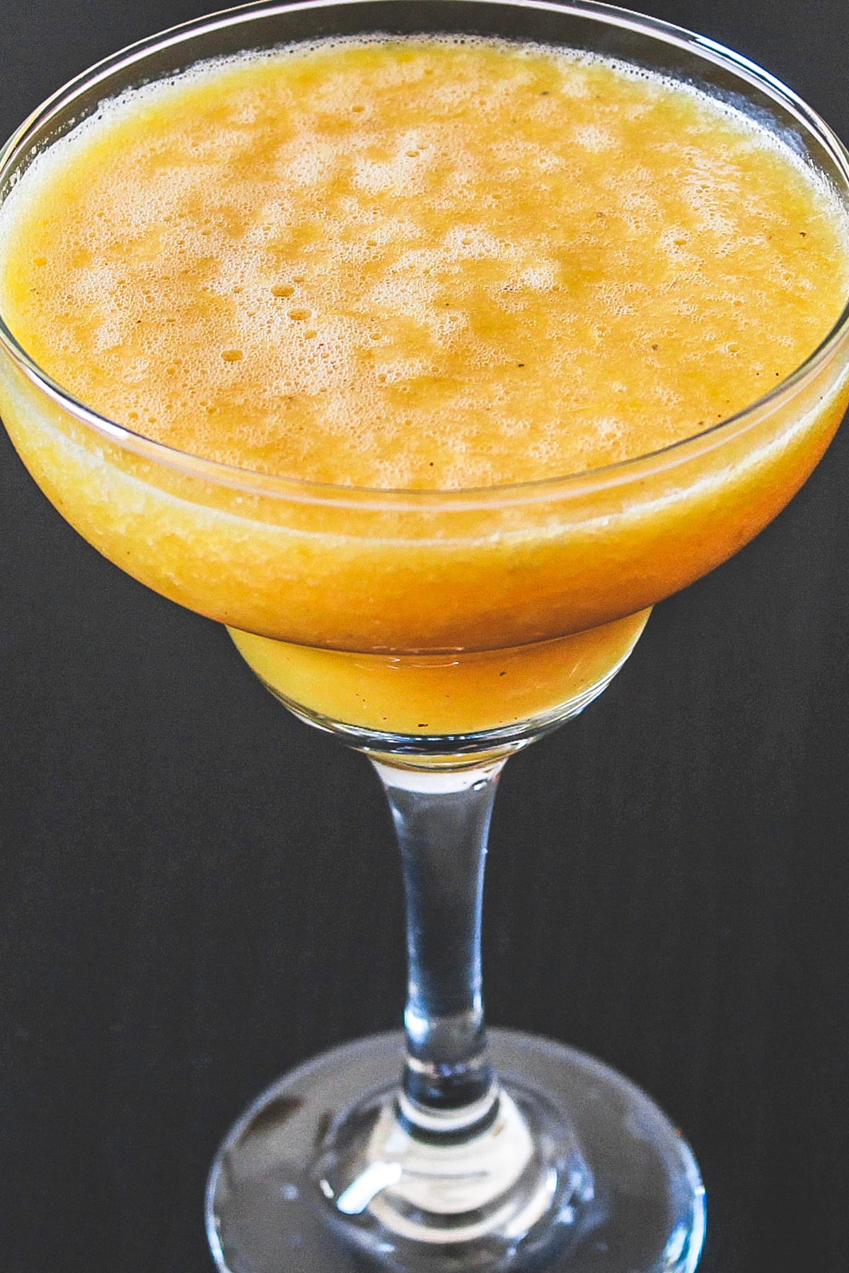 Pineapple orange juice served in glass.