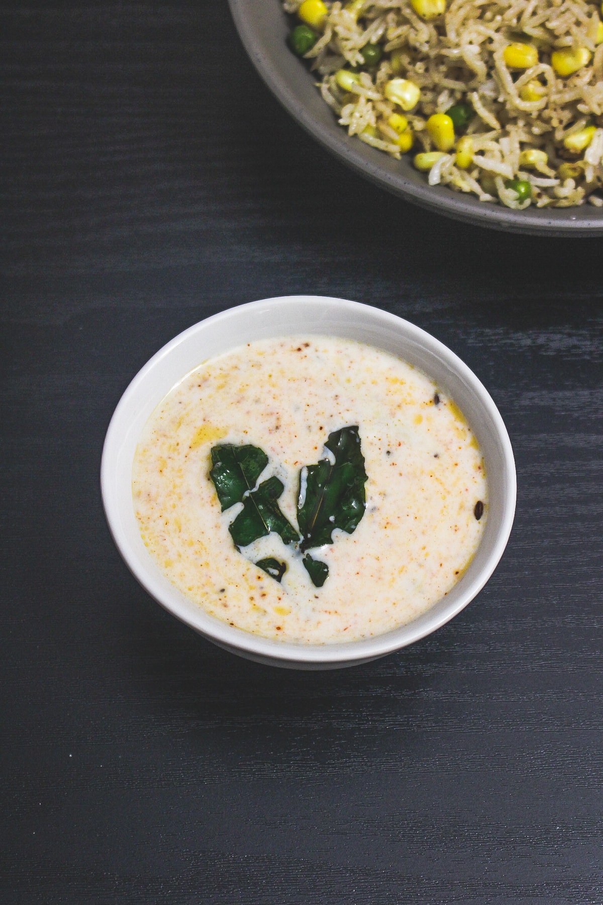 Plain raita served with corn pulao.