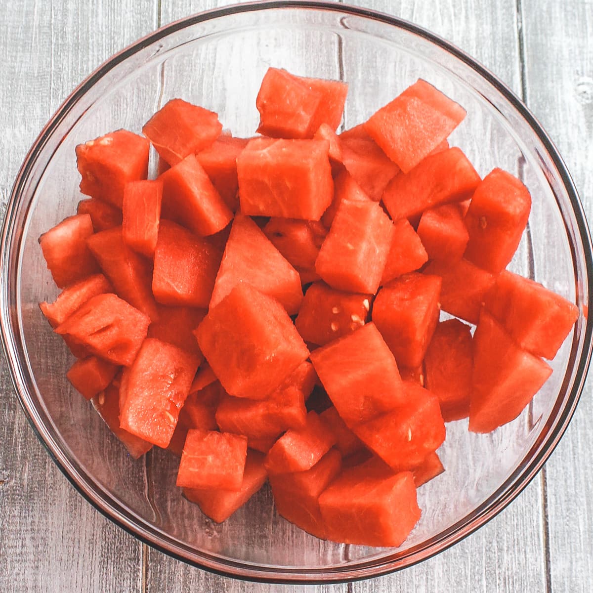 Watermelon cubes in a glass bowl.