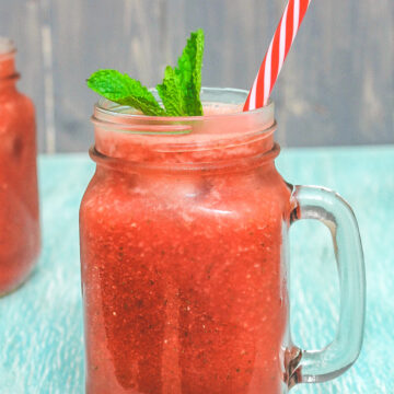 Watermelon mint juice garnished with mint leaves and straw.
